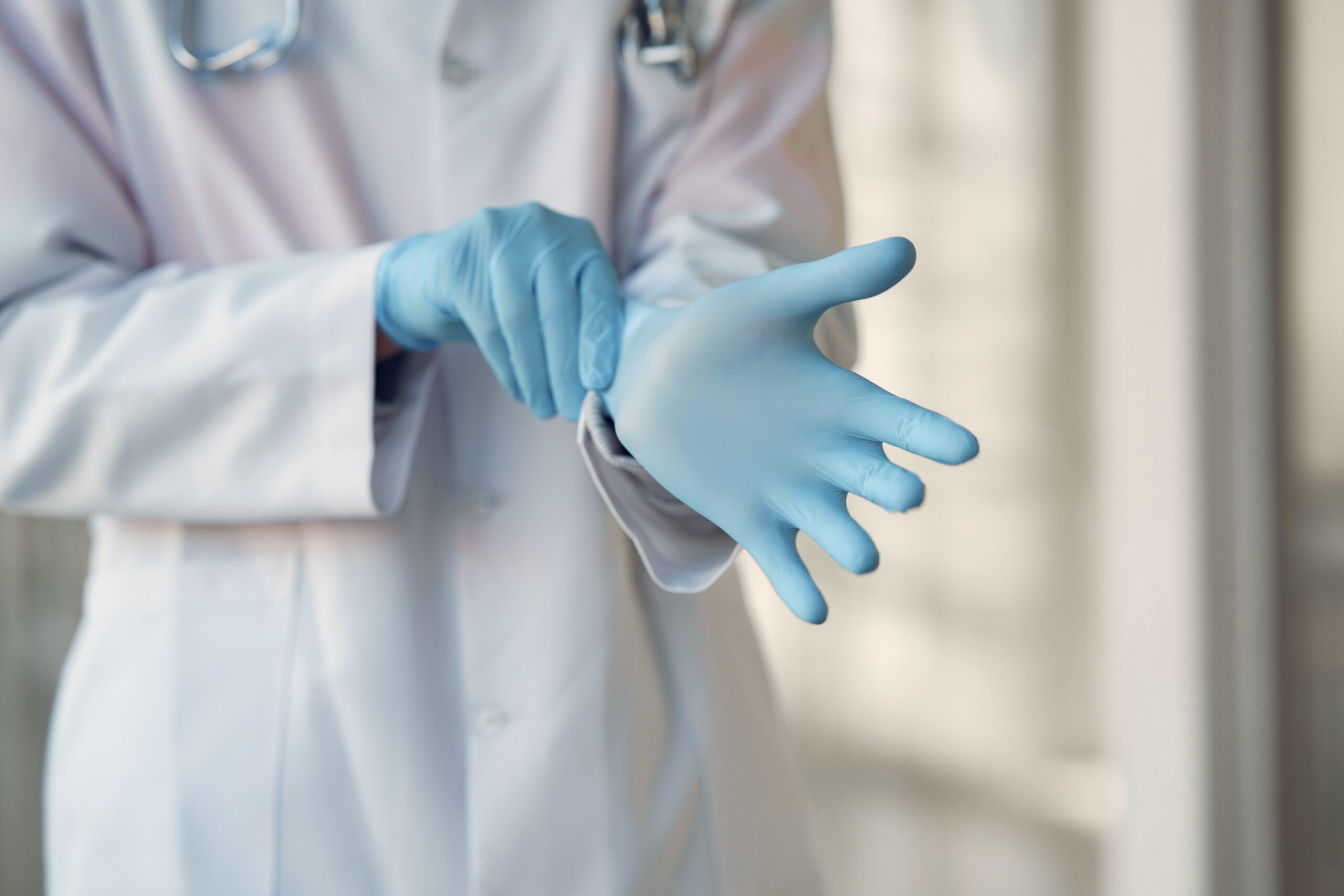 doctor's hands with gloves, singapore abortion clinic